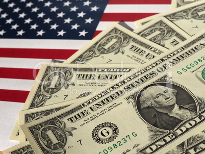 Dollar notes and flag of the United States