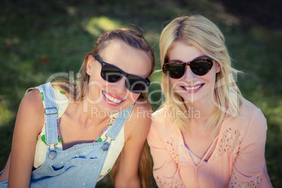Beautiful women wearing sunglasses in park