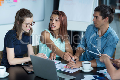 Business executives discussing during meeting