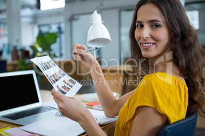 Female graphic designer working at desk