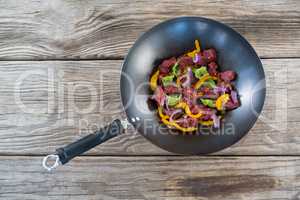 Diced beef in frying pan