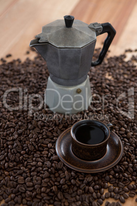 Coffeemaker with coffee beans and coffee mug