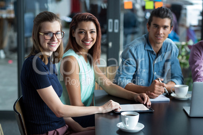 Portrait of business executives sitting in office