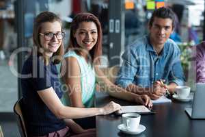 Portrait of business executives sitting in office