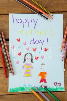 Happy mothers day greeting card on wooden background