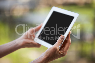 Hands of female staff using digital tablet