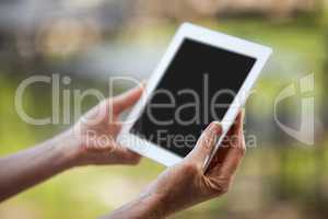 Hands of female staff using digital tablet