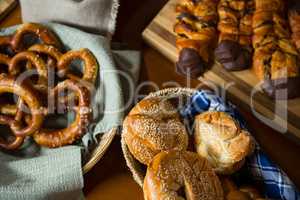 Close-up of various breads in a wicker basket on display counter