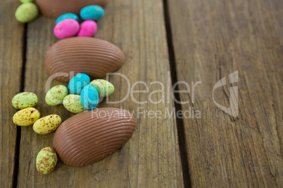 Chocolate Easter eggs on wooden plank