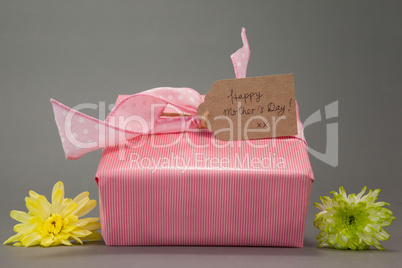Gift box with happy mothers day card and flowers