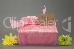 Gift box with happy mothers day card and flowers