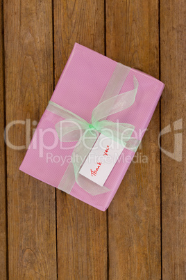 Thank you card with gift box on table