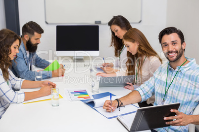 Executives working in conference room