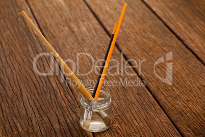 Paint brushes in a jar filled with water