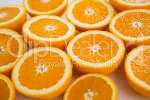 Halved oranges on white background