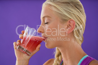 Beautiful woman drinking smoothie