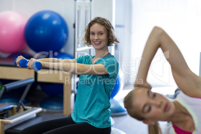 Woman exercising with dumbbell