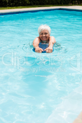 Senior woman swimming in the pool