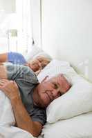 Senior couple sleeping in the bedroom