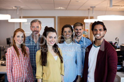 Creative business team standing together in office
