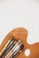 Wooden palette and paint brushes