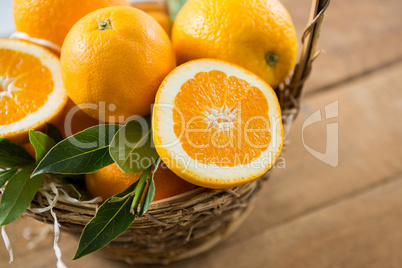 Close-up of oranges in wicker basket