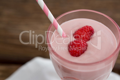 Fresh glass of smoothie with straw