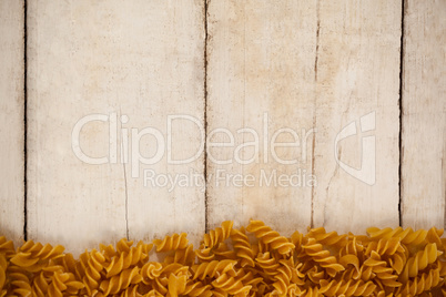 Girandole pasta on wooden background