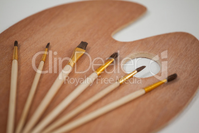 Wooden palette and paint brushes