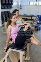 Woman exercising on wunda chair