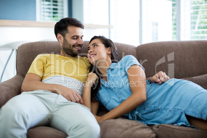 Smiling couple relaxing in the living room