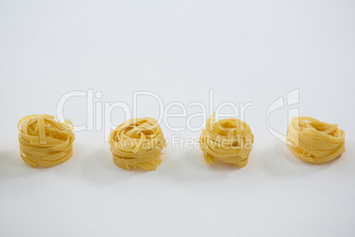 Fettuccine pasta arranged in a row