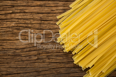 Spaghetti pasta on wooden surface