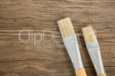 Flat brushes on wooden surface