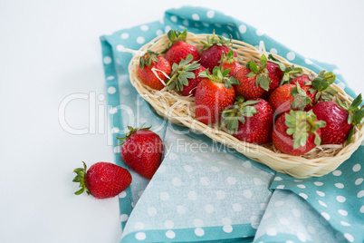 Fresh strawberries in wicker tray
