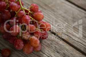 Close-up of red bunch of grapes with water droplets