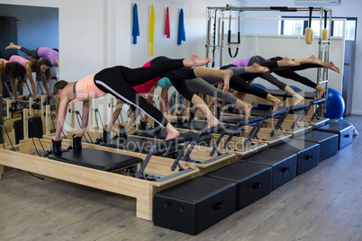 Group of women exercising on reformer