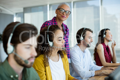 Customer service executive trainer monitoring her team