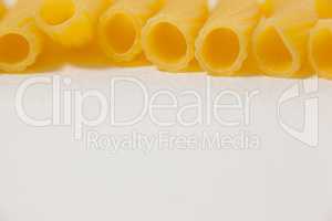 Pennette pasta on white background