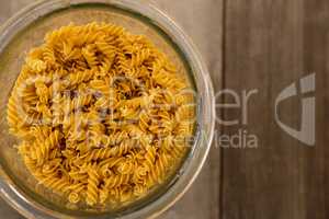 Girandole pasta in a glass container