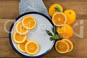 Slices of oranges in plate