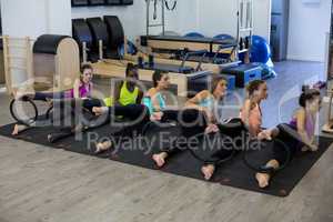 Group of women exercising with pilates ring