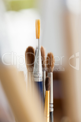 Set of paint brushes in a jar