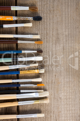 Various colorful paintbrush arranged in a row