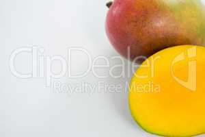 Halved mango on white background