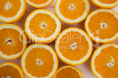 Halved oranges on white background