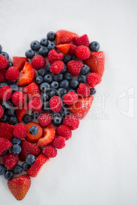 Close-up of various fruits forming a heart shape