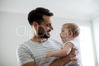 Father holding his baby girl