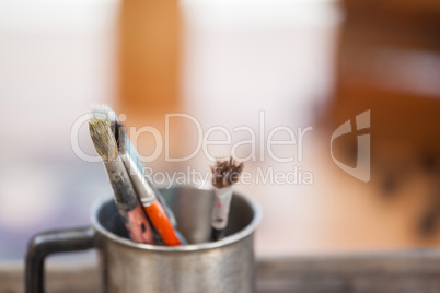 Set of paint brushes in a mug