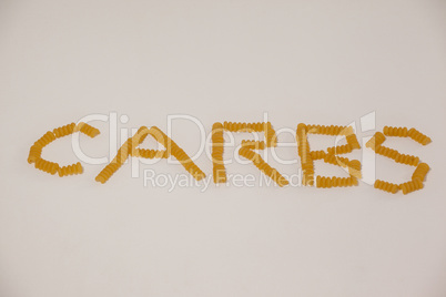 Conchiglie pasta arrange in shape of carbs text